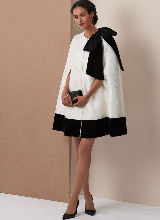 Vogue Schnittmuster V2133 Kurzes Cape und tailliertes Kleid mit abnehmbarer Schleife für Damen